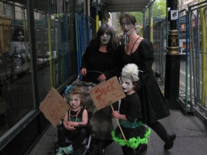 A family of zombies just outside Starbucks