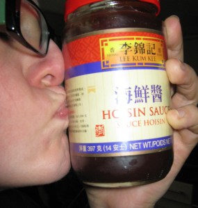 jar of hoisin sauce kissing a jar of hoisin sauce
