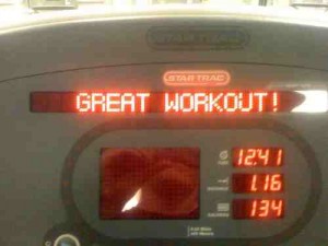 Photo of the screen on an exercise bike. It reads GREAT WORKOUT! in red LCD letters. Photo by Flickr user Tim Dorr, shared under Creative Commons.